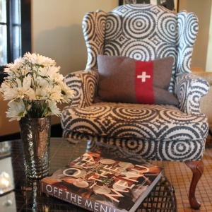 off the menu book on coffee table and lounge chair 